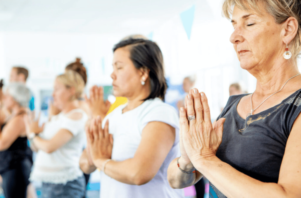 Yoga class, hands in Anjali mudra